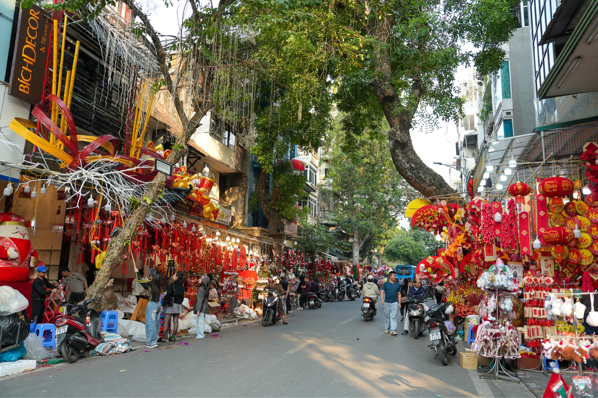 Hang Ma Street is vibrant with colors and bustling with Christmas and New Year decorations